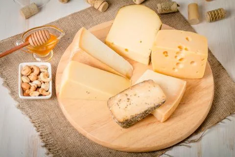 Assorted Cheese Plate with Red Wine, Nuts and Honey Stock Photos