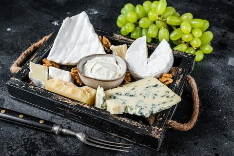 Assorted Cheese platter with Brie, Camembert, Roquefort, parmesan, blue cream Stock Photos