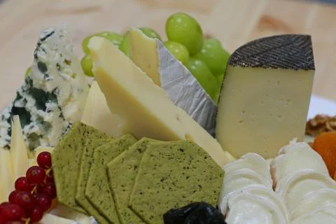 Assorted cheese platter in a buffet display Stock Photos