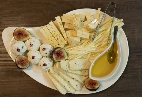 Assorted cheeses on a plate Stock Photos