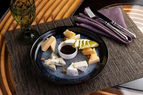Assorted cheeses in a plate. Stock Photos