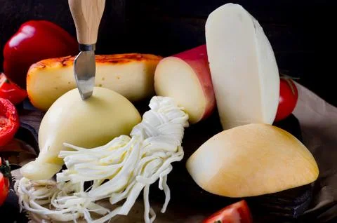 Assorted cheeses in various shapes and sizes Stock-Fotos