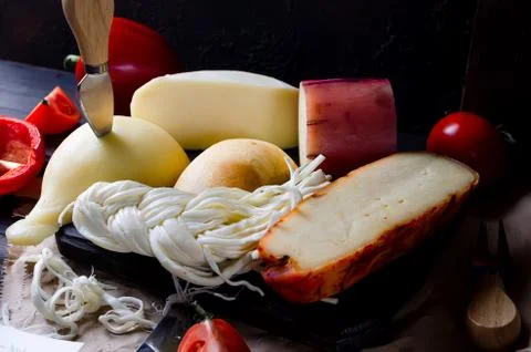 Assorted cheeses in various shapes and sizes Stockfoto's