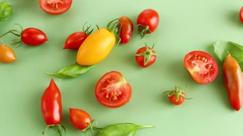 Assorted cherry tomatoes halves seeds and juicy pulp closeup Stock Footage 313955131