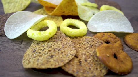 Assorted Chips in Different Shapes With Slow Circular Camera Movement Stock Footage 345611215