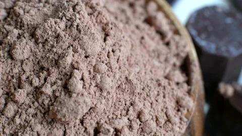 Assorted chocolate and cocoa on black background, close up. High angle view Stock Footage 102427359