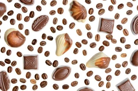 Assorted chocolate candy on the background of coffee beans isolated Stock Photos
