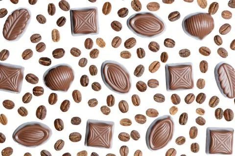 Assorted chocolate candy on the background of coffee beans isolated Stock Photos