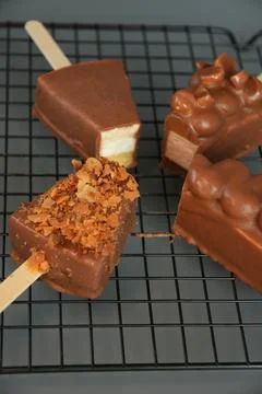 Assorted Chocolate Cheesecake Pops on Wire Rack Close Up Stock Photos