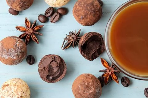 Assorted chocolates. candy balls of different types of chocolate on a blue wo Stock Photos