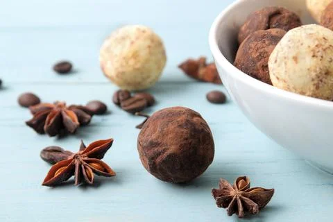 Assorted chocolates. candy balls of different types of chocolate on a blue wo Stock Photos