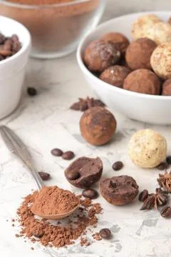 Assorted chocolates. Candy balls of different types of chocolate on a light c Stock Photos