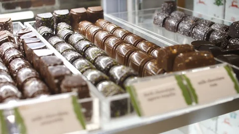 Assorted chocolates on display at a chocolatier Stock Footage 105223606