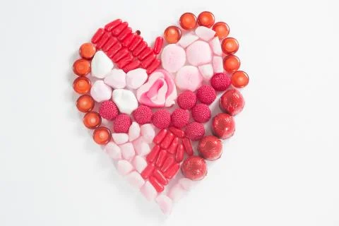 Assorted chocolates placed in heart shape Stock Photos