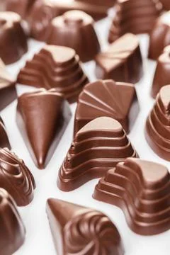 Assorted chocolates on white Stock Photos