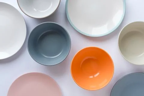 Assorted clean empty bowls and plates for food Stock Photos