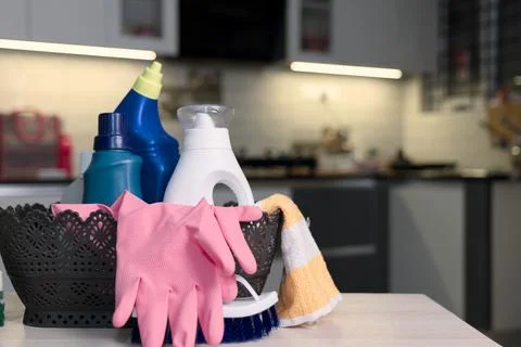 Assorted Cleaning Supplies in Modern Kitchen Setting Stock Photos