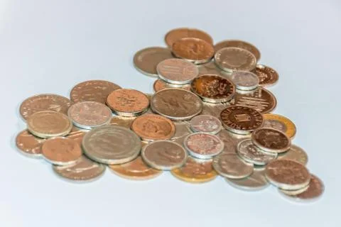 Assorted coins, both old ones which are no longer in circulation and contempo Stock Photos