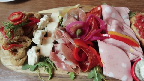 Assorted cold cut appetiser with cheese, pickle, ham Stock Footage 313671233