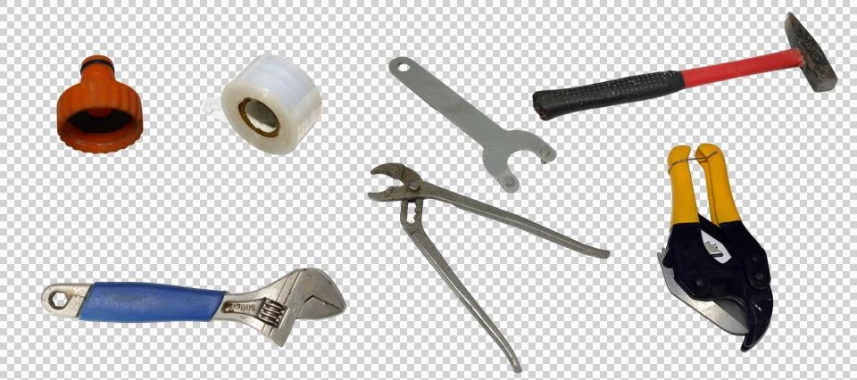 Assorted collection of manual hand tools and plumbing hardware Stock Photos