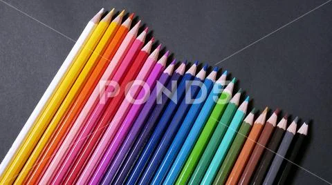 Assorted Colorful Color Pencils on Black Background Stock Photos