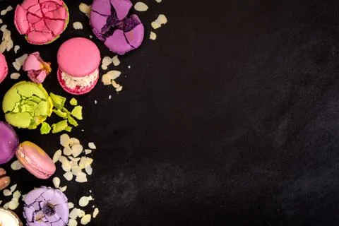 Assorted colorful macaroons on a dark background Stock Photos
