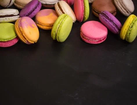 Assorted colorful macaroons on a dark background Stock-Fotos