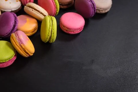 Assorted colorful macaroons on a dark background Stock-Fotos