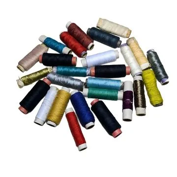 Assorted Colorful Sewing Thread Spools on White Background Fotos de archivo