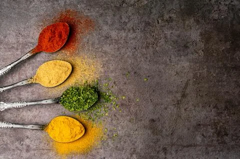 Assorted of colorful spices (red pepper powder, turmeric powder, black pepp.. Stock Photos