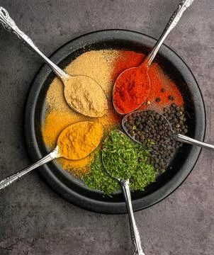 Assorted of colorful spices (red pepper powder, turmeric powder, black pepp.. Stock Photos