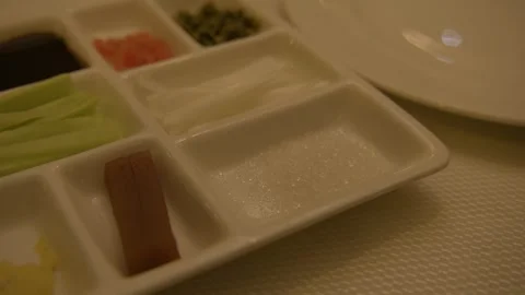Assorted Condiments and Vegetables Served in Divided Dish at Beijing Restaurant Stock Footage 345783343