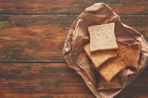 Assorted cookies on brown paper in a rustic setting Stock Photos