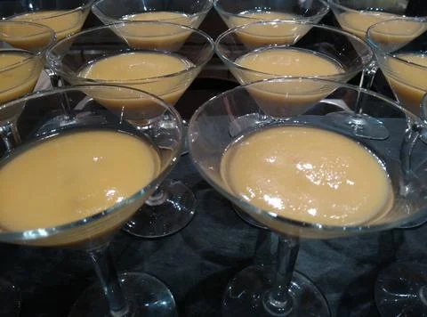 Assorted Creamy Pudding Desserts Served in Elegant Glass Dessert Cups Stock Photos