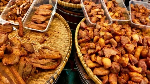 Assorted Crispy Pork Cuts Displayed at Asian Street Food Market Stall Stock Footage 329165875