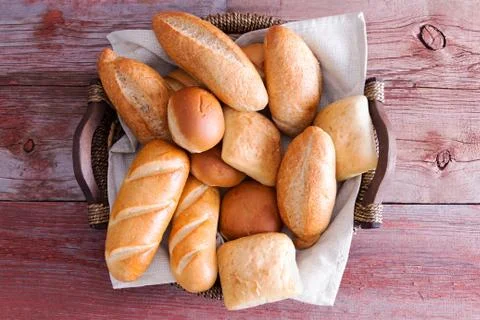 Assorted crusty fresh bread rolls in a basket Stock Photos