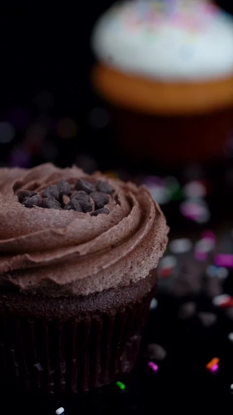 Assorted Cupcakes Rotating on Reflective Surface Stock Footage 330516815