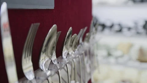Assorted Cutlery Arranged on Wall Display at Kitchenware Store Stock Footage 321769211