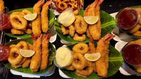 Assorted Deep Fried Seafood Platters with Shrimp, Squid Rings and Dipping Sauces 스톡 동영상 340990460