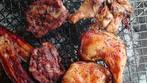 Assorted delicious grilled meat over the coals on a barbecue Stock Footage 91660126