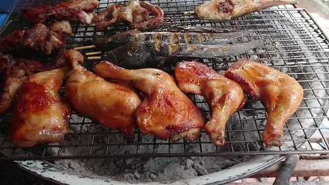 Assorted delicious grilled meat over the coals on a barbecue, Zoom in. Stock Footage 95045343
