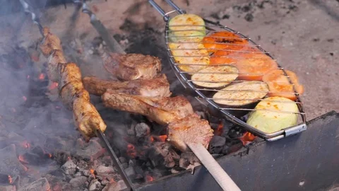 Assorted delicious grilled meat with vegetable over the coals on a barbecue Stock Footage 103101247