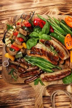 Assorted delicious grilled meat with vegetable on a barbecue. Grilled pork sh Stock Photos
