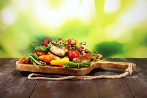 Assorted delicious grilled meat with vegetable on a barbecue. Grilled pork sh Stock Photos