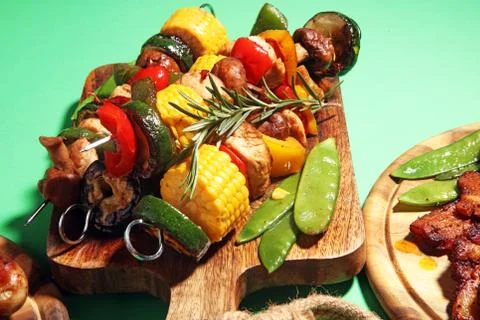 Assorted delicious grilled meat with vegetable on rustic table Stock Photos