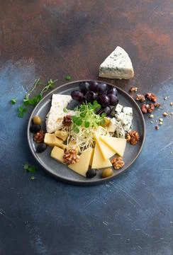 Assorted different cheeses in a plate Stock Photos