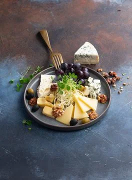 Assorted different cheeses in a plate Stock Photos