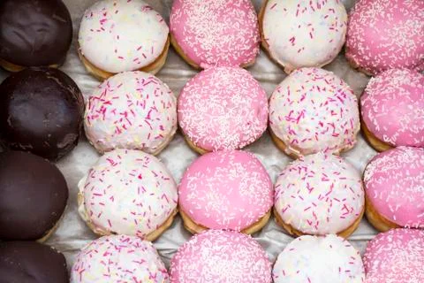 Assorted different Delicious donuts in a box Stock Photos
