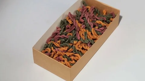 Assorted different kinds of pasta in a paper box Stock Footage 75575074
