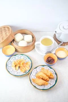 Assorted Dim Sum With Fried Dumplings, Steamed Buns In Bamboo Steamer, Gree.. Stock Photos